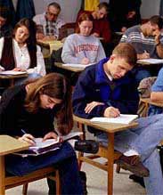 A photo of undergraduate students writing at their desks. 