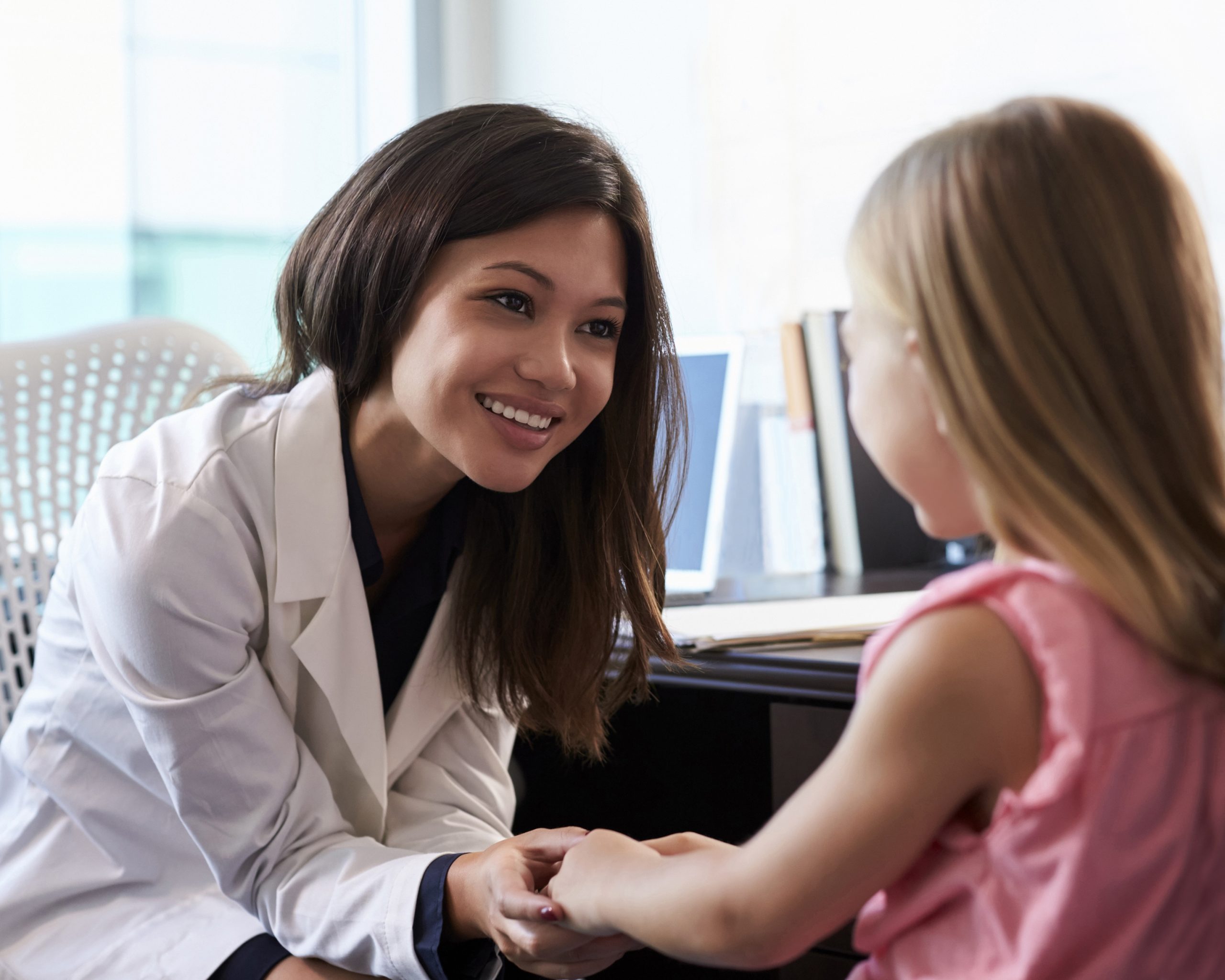 Clinical Nutritionist meeting with a child in a hospital setting.